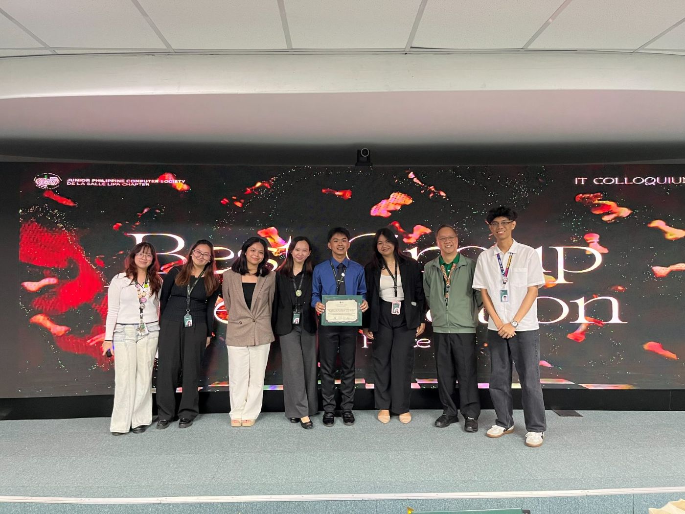 Group 6 on stage receiving the Best Group Presentation award