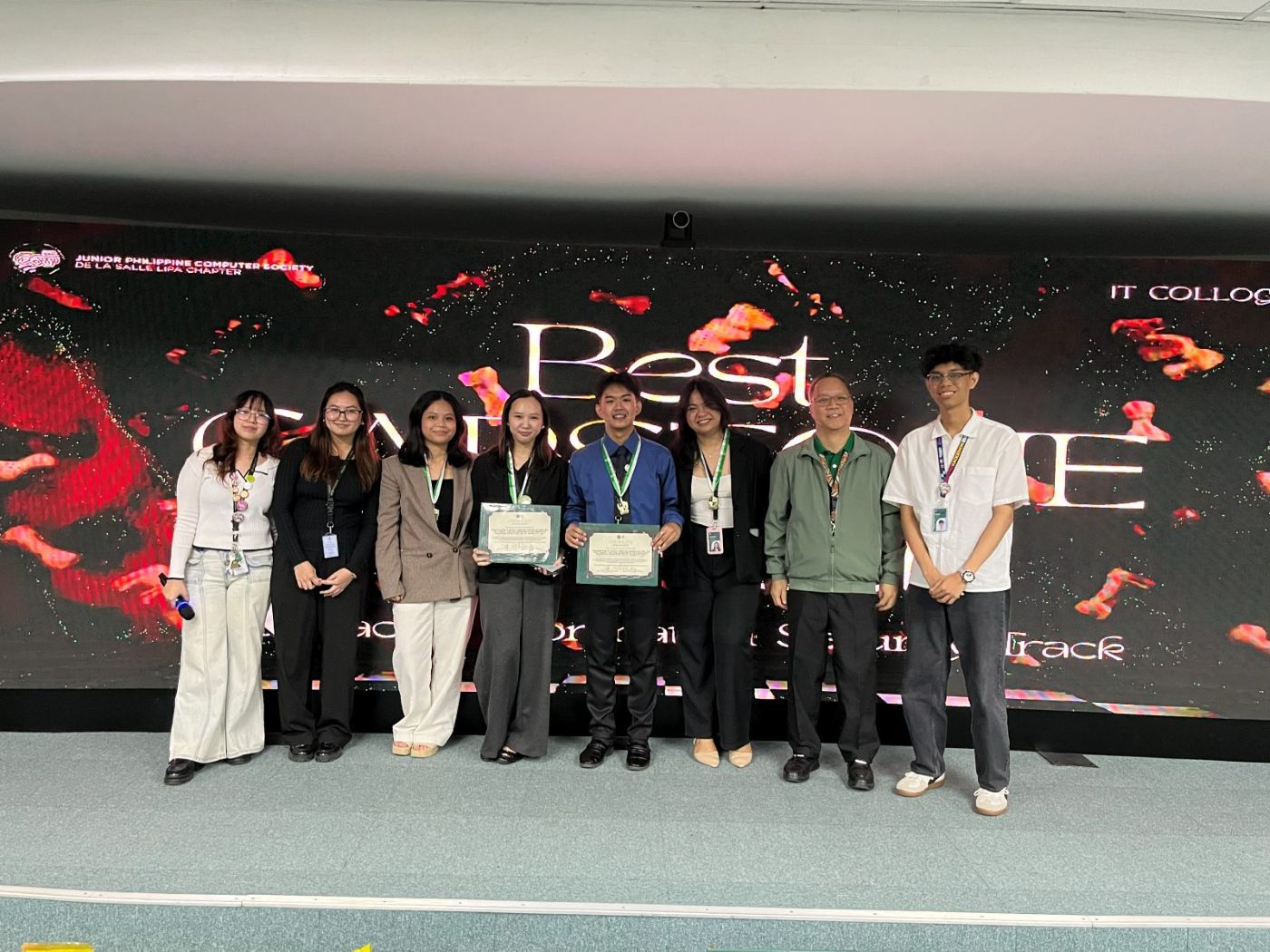 Group 6 on stage receiving the Best Capstone award for the Information Security Track